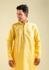Nawab Parker men's designer yellow fancy kurta pajama set front half view