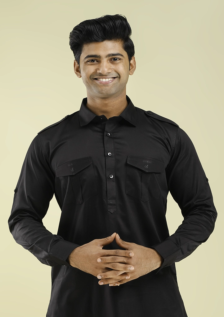 A Complete Guide to Pathani Kurta Pajama: What to Know First nawab parker black pathani kurta pajama for men wedding festive style half front view